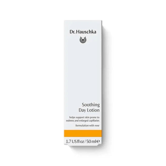 A tall, narrow white box of Dr. Hauschka Soothing Day Lotion with black text and a bright orange band near the bottom, shown on a clean white background.