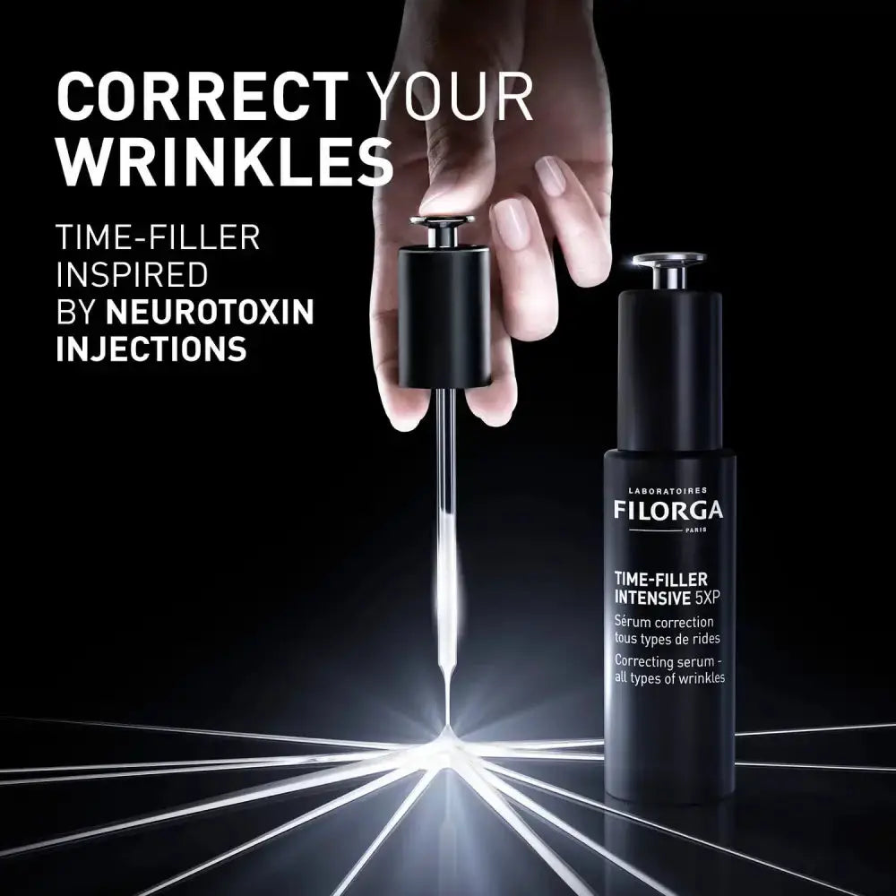 Filorga serum bottle with a hand holding a dropper on a black background