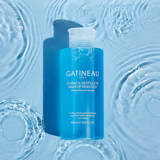 Blue bottle of Gatineau eye makeup remover on a blue water background