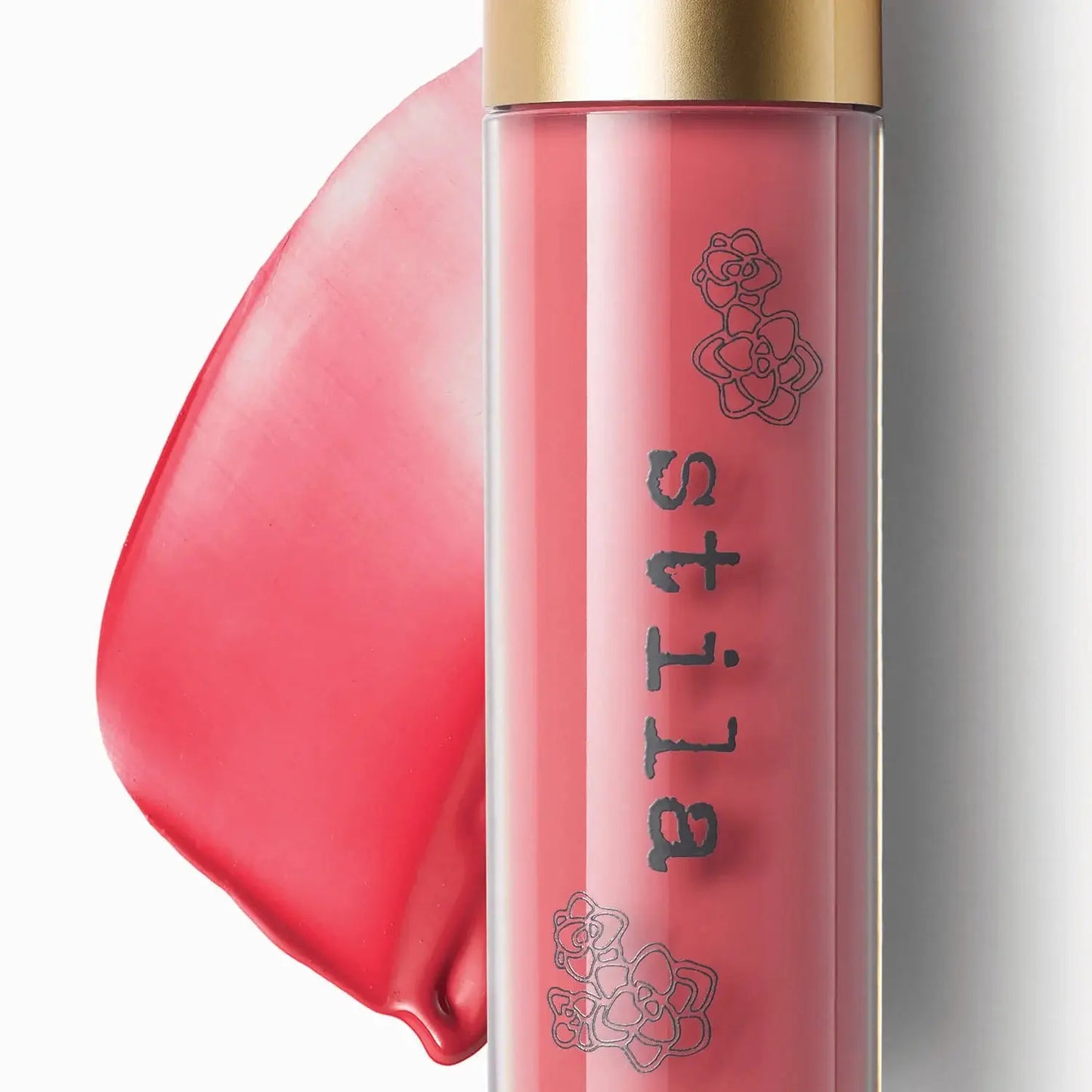 Stila lip gloss with a gold cap on a white background