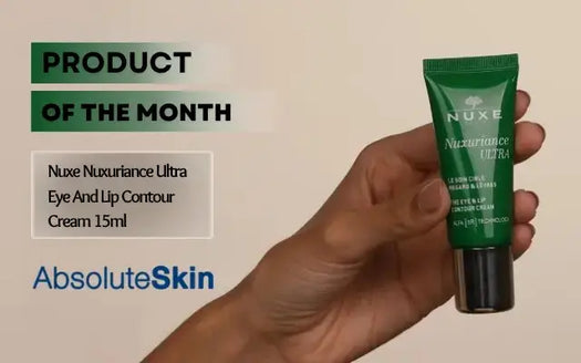 A hand holding a green tube of Nuxe Nuxuriance Ultra Eye And Lip Contour Cream against a beige background with promotional text overlays.
