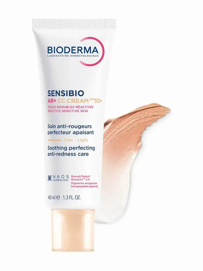 Bioderma Sensibio AR+ CC Cream T5+ in a white squeeze tube with a beige cap, shown next to a peach-colored cream swatch on a white background.