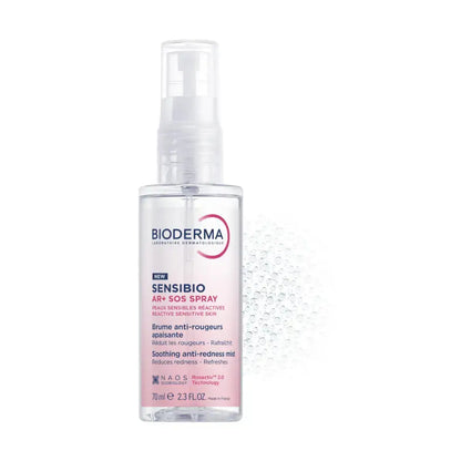 Bioderma Sensibio Anti-Redness Spray in a clear plastic bottle with a white spray pump, featuring a pink and blue label, set against a white background with a subtle water droplet pattern.