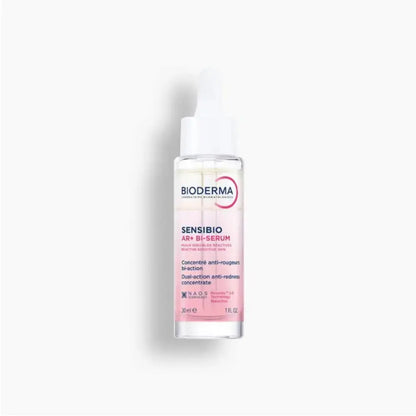 Bioderma Sensibio AR+ Bi-Serum double-action anti-redness serum in a clear bottle with a white cap, showing pink liquid inside, on a light gray background.