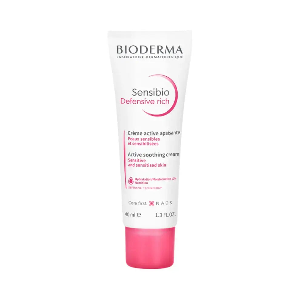 Bioderma Sensibio Defensive Rich Active Soothing Cream in a white squeeze tube with a bright pink cap, shown on a plain white background.