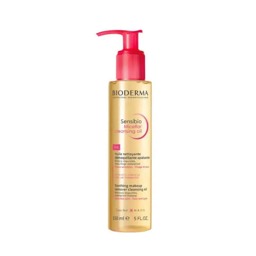 Bioderma Sensibio Cleansing Oil makeup remover in a 150 ml pump bottle with a gold body and a bright pink pump dispenser, shown on a plain white background.