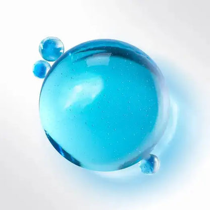 Blue gel-like substance with bubbles on a white background