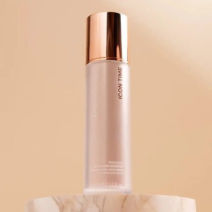 Skincare bottle with rose gold cap on a beige background