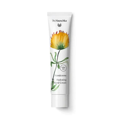 Dr. Hauschka hydrating hand cream tube with a flower design on a white background