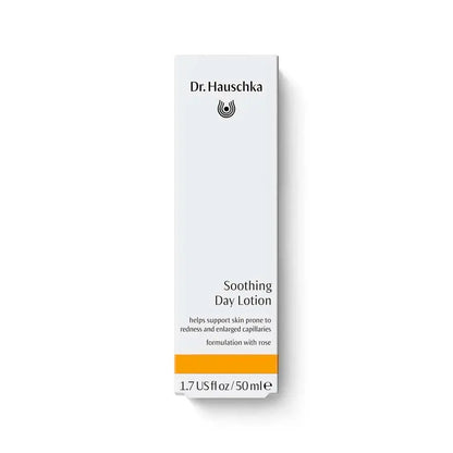 A tall, narrow white box of Dr. Hauschka Soothing Day Lotion with black text and a bright orange band near the bottom, shown on a clean white background.