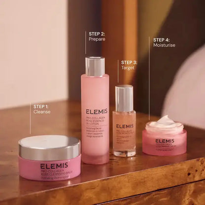 Set of Elemis skincare products on a wooden surface with step indicators.
