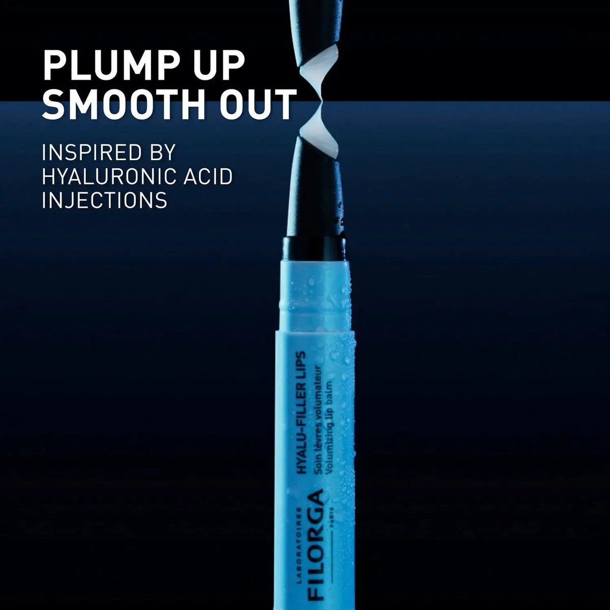 Blue lip balm with text 'Plump Up Smooth Out' and 'Inspired by Hyaluronic Acid Injections' on a dark background.