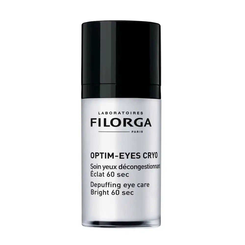 A bottle of Filorga Optim-Eyes Cryo depuffing eye care serum, featuring a sleek black cap and a clear cylindrical bottle showing the white liquid inside, set against a plain white background.