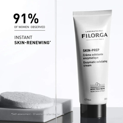 A white tube of FILORGA Skin-Prep enzymatic exfoliating cream stands on a reflective surface against a clean white background, with marketing text on the left side reading '91% OF WOMEN OBSERVED' and 'INSTANT SKIN-RENEWING'.