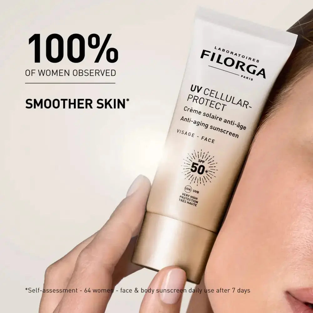 Filorga UV Cellular Protect sunscreen tube held by a hand with a neutral background