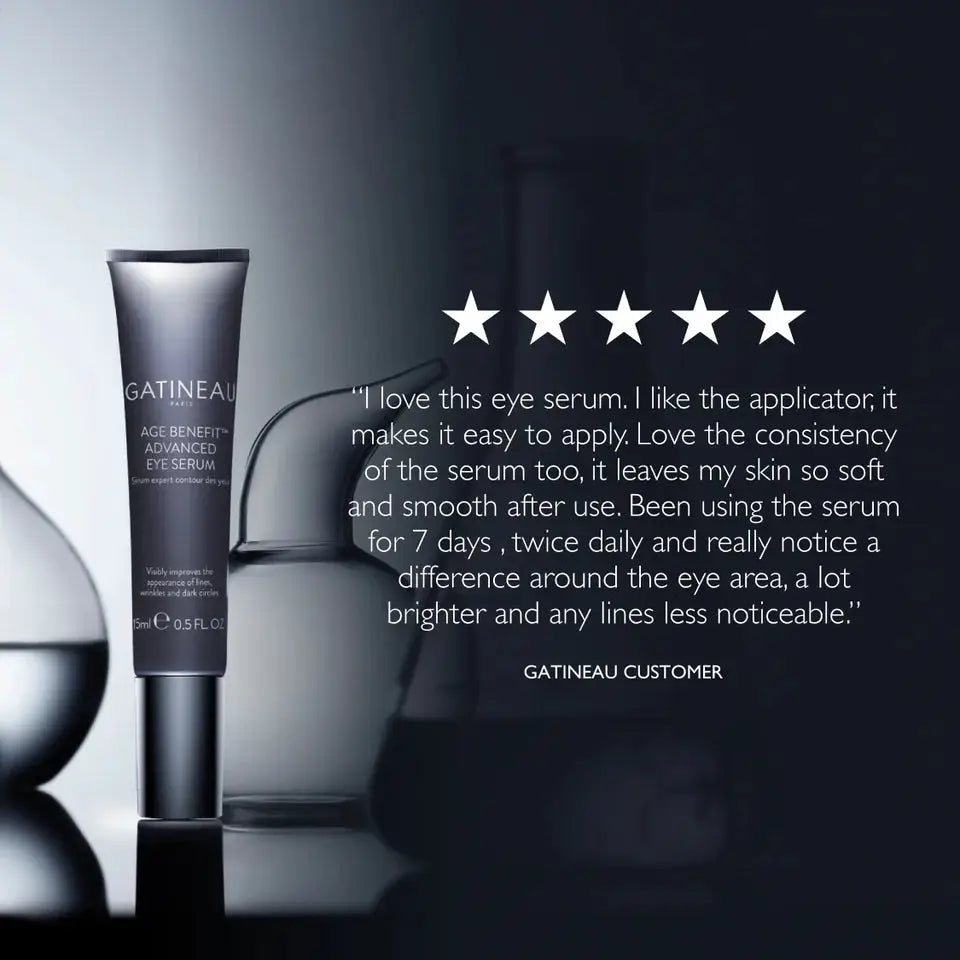 A tube of GATINEAU Age Benefice Advanced Eye Serum stands on a reflective surface against a dark studio background, with a customer review quote and five stars overlaid on the right side.
