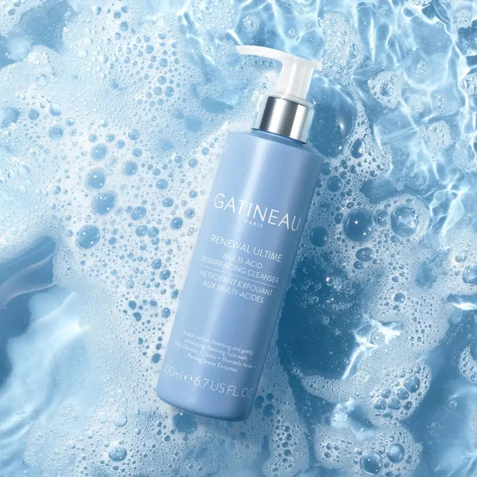 Gatineau skincare bottle on a blue bubbly background