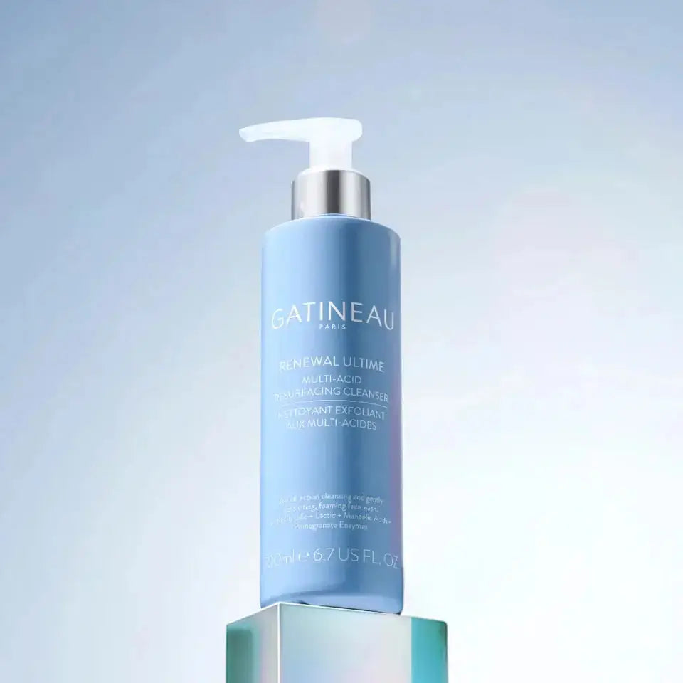 Blue skincare bottle with pump labeled 'Gatineau' on a light blue background