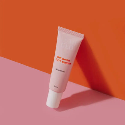 Pink serum tube labeled 'Puff Glo' on a pink and orange background