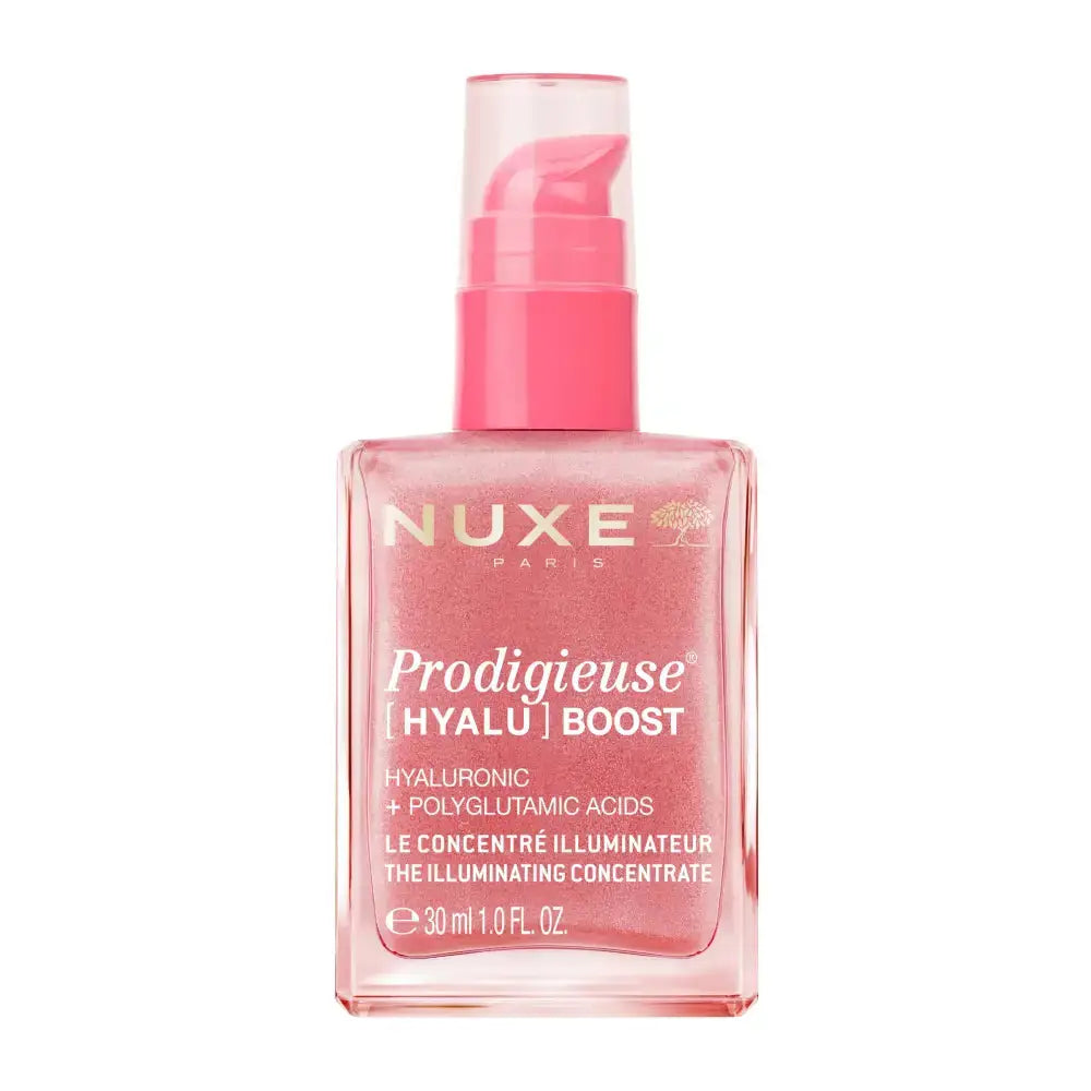 Nuxe Paris Prodigieuse Hyalu Boost illuminating serum in a square pink bottle with a pink pump dispenser, shown on a white background.