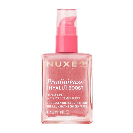 Nuxe Paris Prodigieuse Hyalu Boost illuminating serum in a square pink bottle with a pink pump dispenser, shown on a white background.
