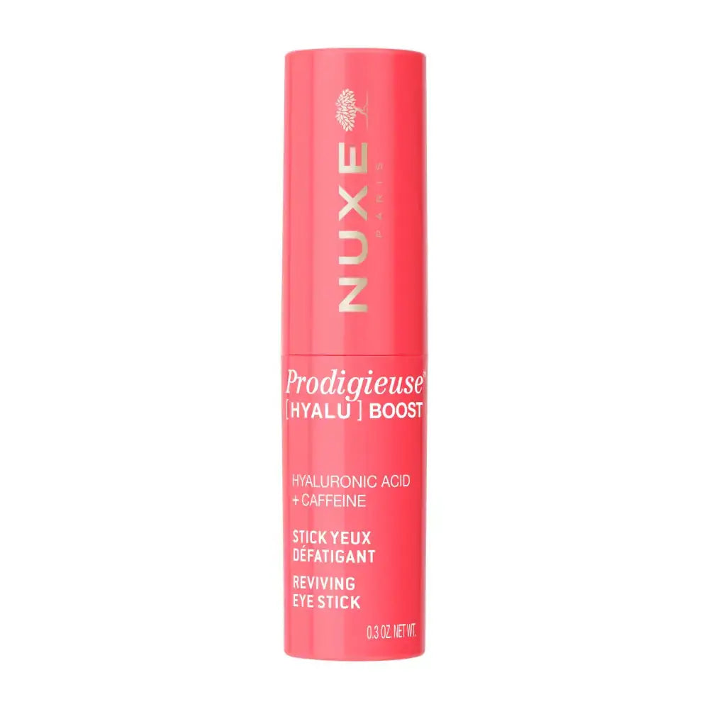 Nuxe Prodigieuse Hyalu' Boost Reviving Eye Stick in a vibrant coral pink tube with gold lettering, shown on a solid white background.