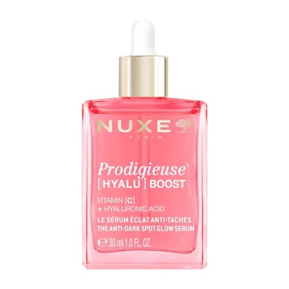 Nuxe Paris Prodigieuse [Hyalýrone] Boost serum in a 30 ml pink glass dropper bottle with a gold collar and white dropper cap, on a white background.