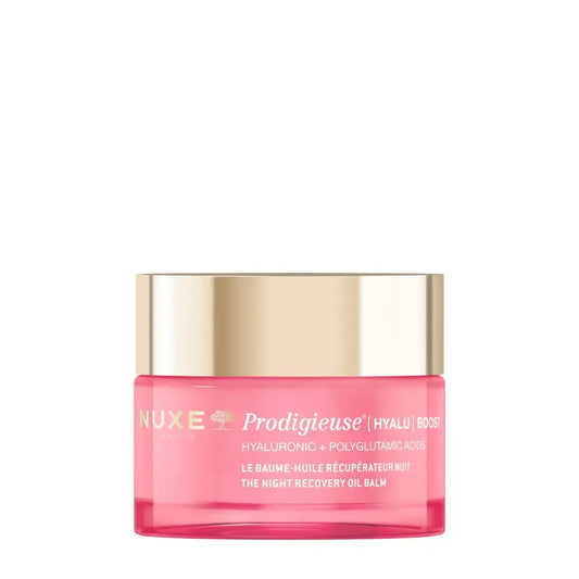 Nuxe Prodigieuse (Hyalu) Boost The Night Recovery Oil Balm in a translucent pink jar with a metallic gold lid, shown on a solid white background.