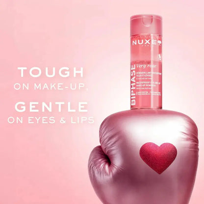 Nuxe product with pink boxing glove on a pink background