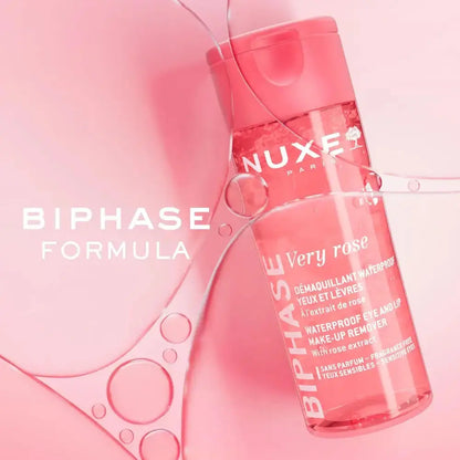 Nuxe Very Rose Biphase Formula makeup remover bottle on a pink background