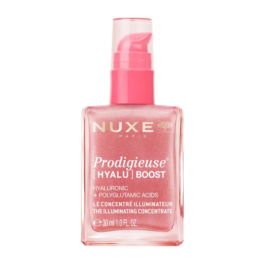 Nuxe Paris Prodigieuse Hyalu Boost illuminating serum in a square pink bottle with a pink pump dispenser, shown on a white background.