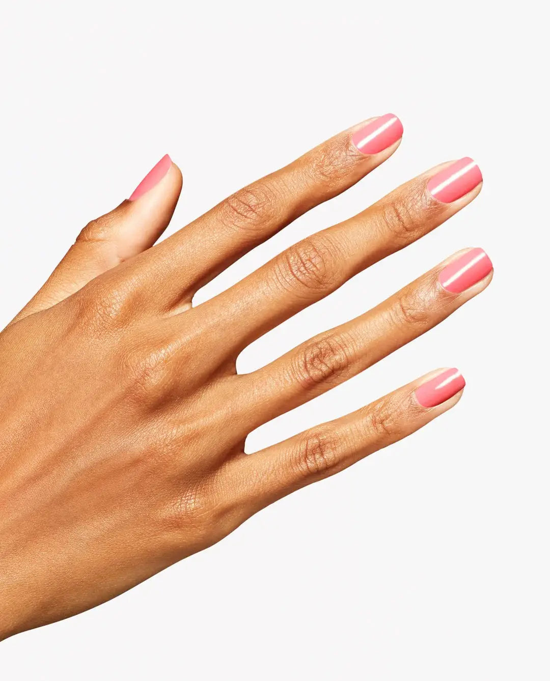 Hand with pink nail polish on a white background