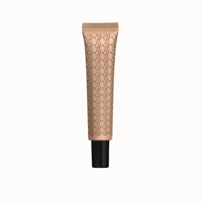A single tube of NYX makeup foundation in a warm beige shade, featuring a repeating black NYX logo pattern on the tube and a solid black cap, centered against a plain white background.
