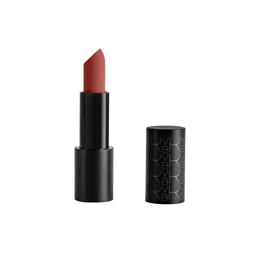 A lipstick bullet in a warm muted terracotta shade, shown partially exposed in a black tube next to its matching black cap on a plain white background.