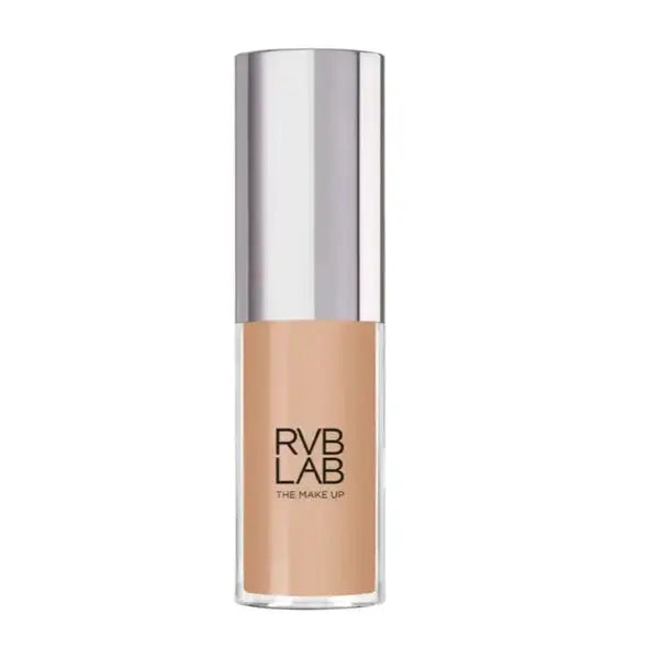 RVB LAB The Make Up liquid foundation in a clear cylindrical bottle showing the beige-tan shade, topped with a reflective silver cap, on a plain white background.