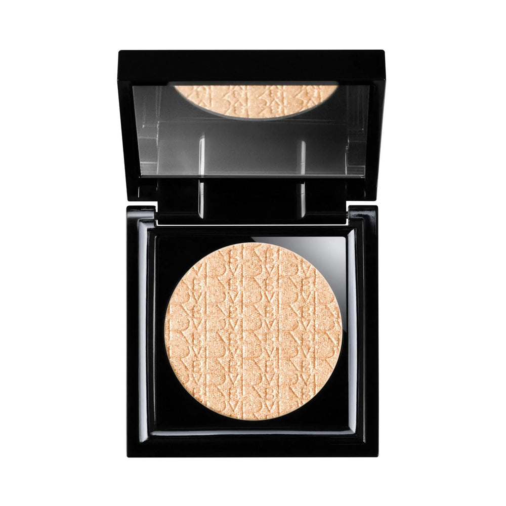 Makeup compact with beige powder and Dior logo on a white background