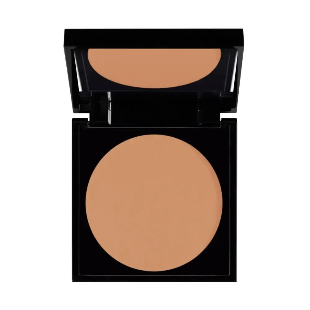 Compact powder in a black case on a white background