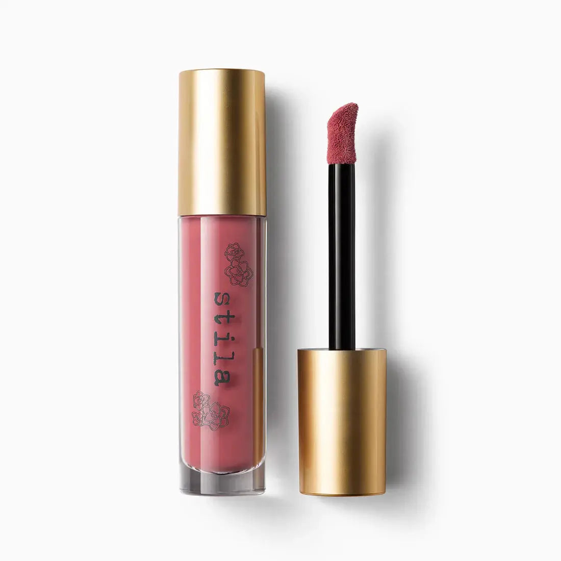 Lip gloss with gold cap and pink shade on a white background