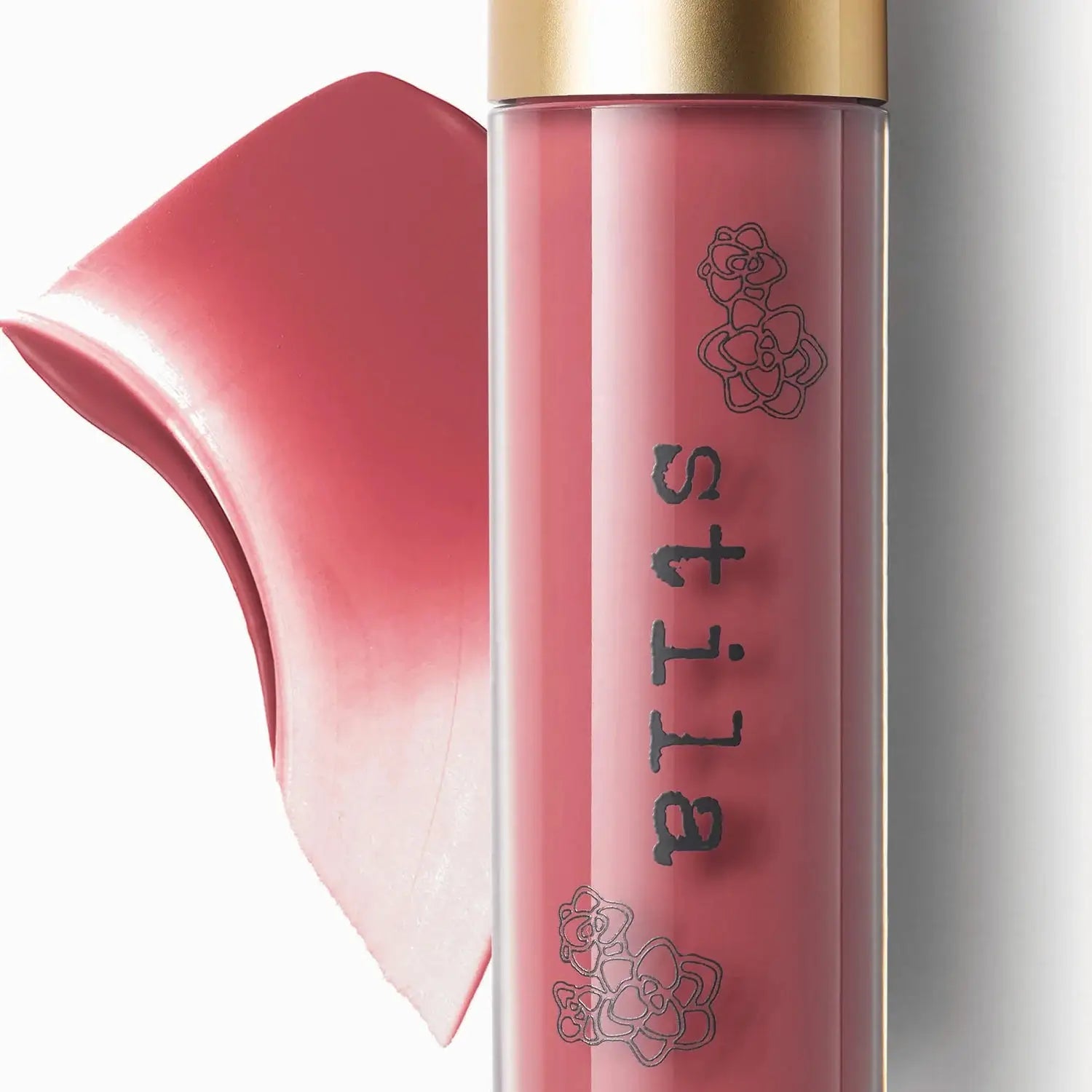 Stila lip gloss with a gold cap on a white background