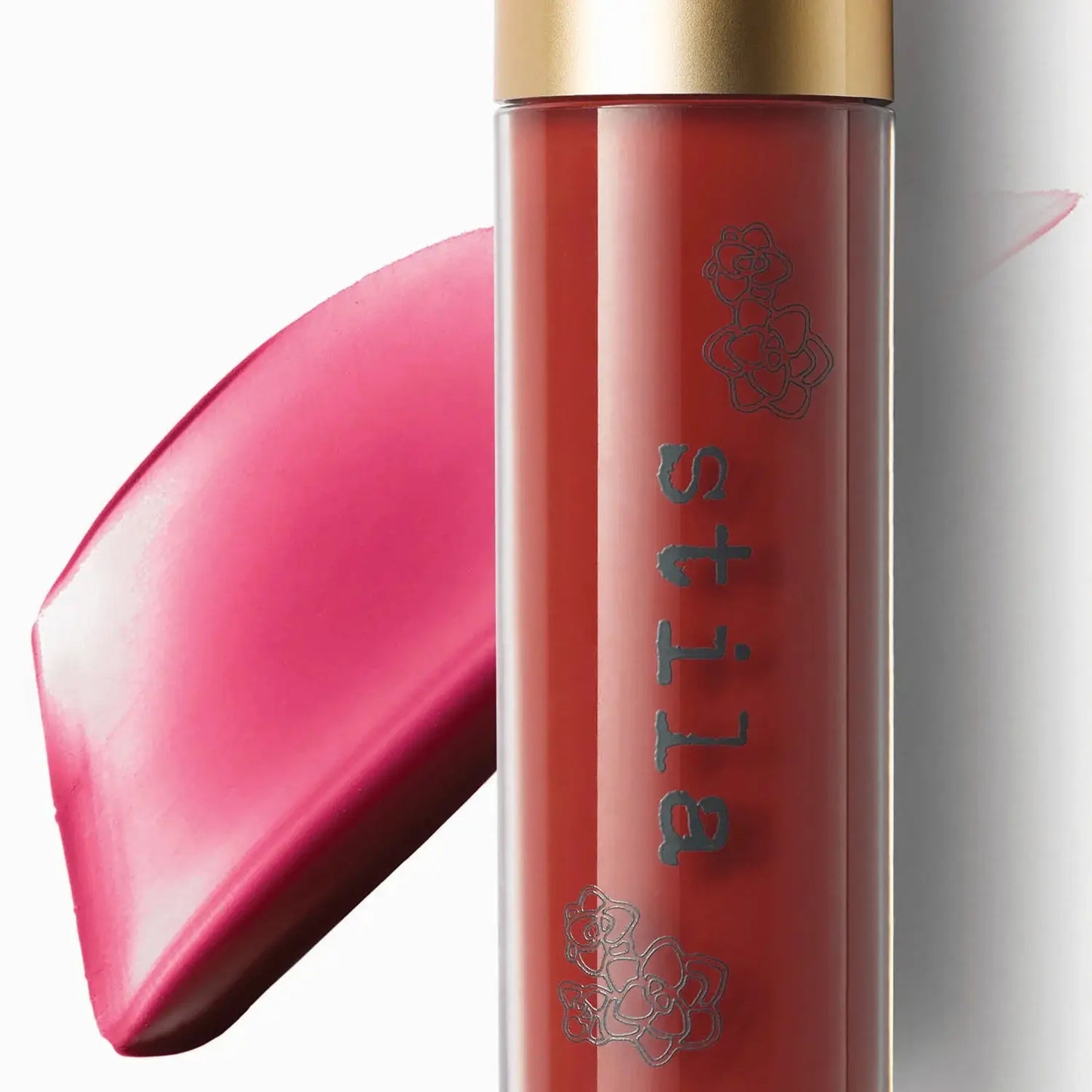 Lip gloss with 'stila' branding on a white background