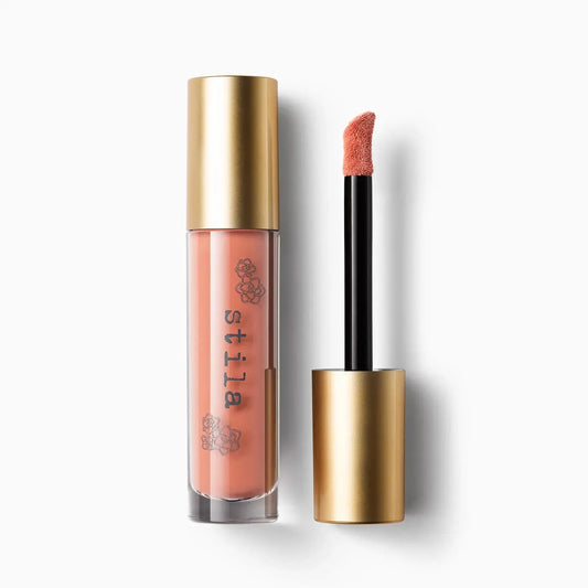 Stila lip gloss with applicator on a white background