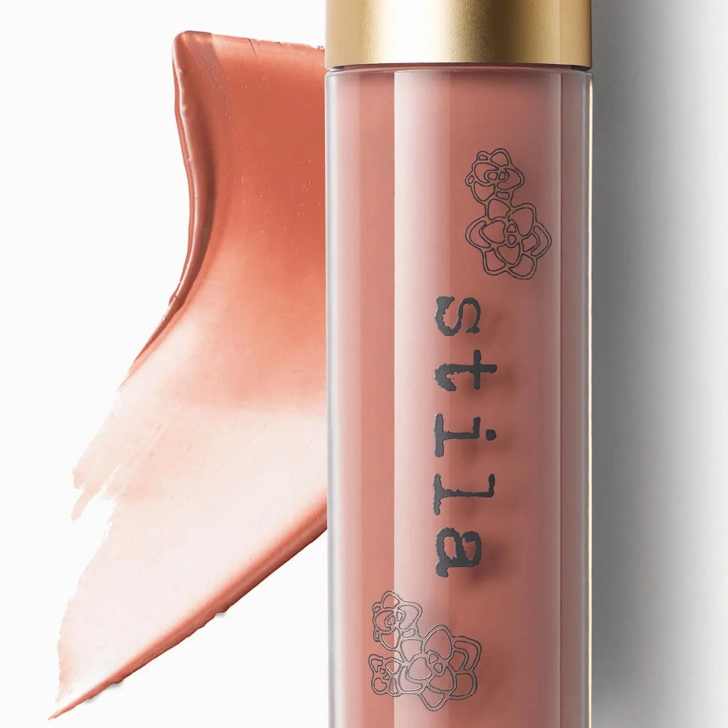 Stila lip gloss with a gold cap on a white background