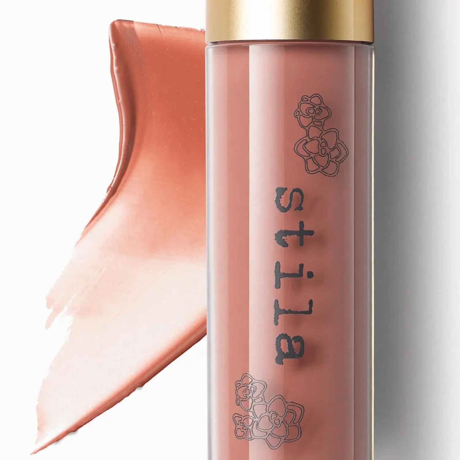 Stila lip gloss with a gold cap on a white background