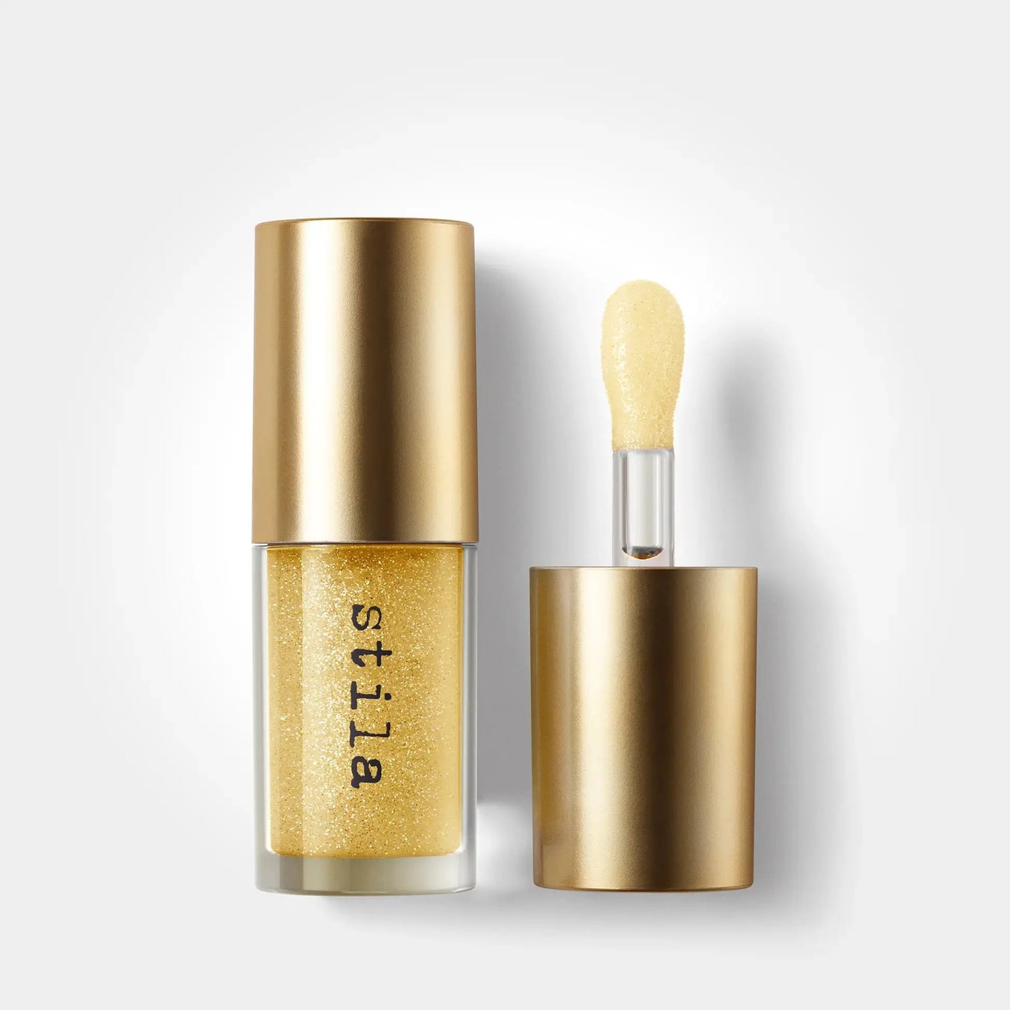 Stila cosmetic product with gold cap and body on a white background