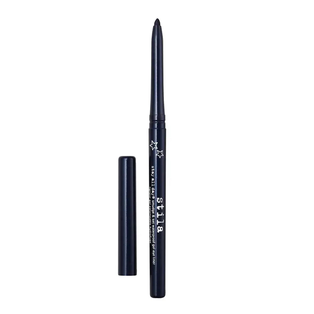 A dark navy blue eyeliner pencil with white text and star graphics, shown alongside its matching cap on a solid white background.