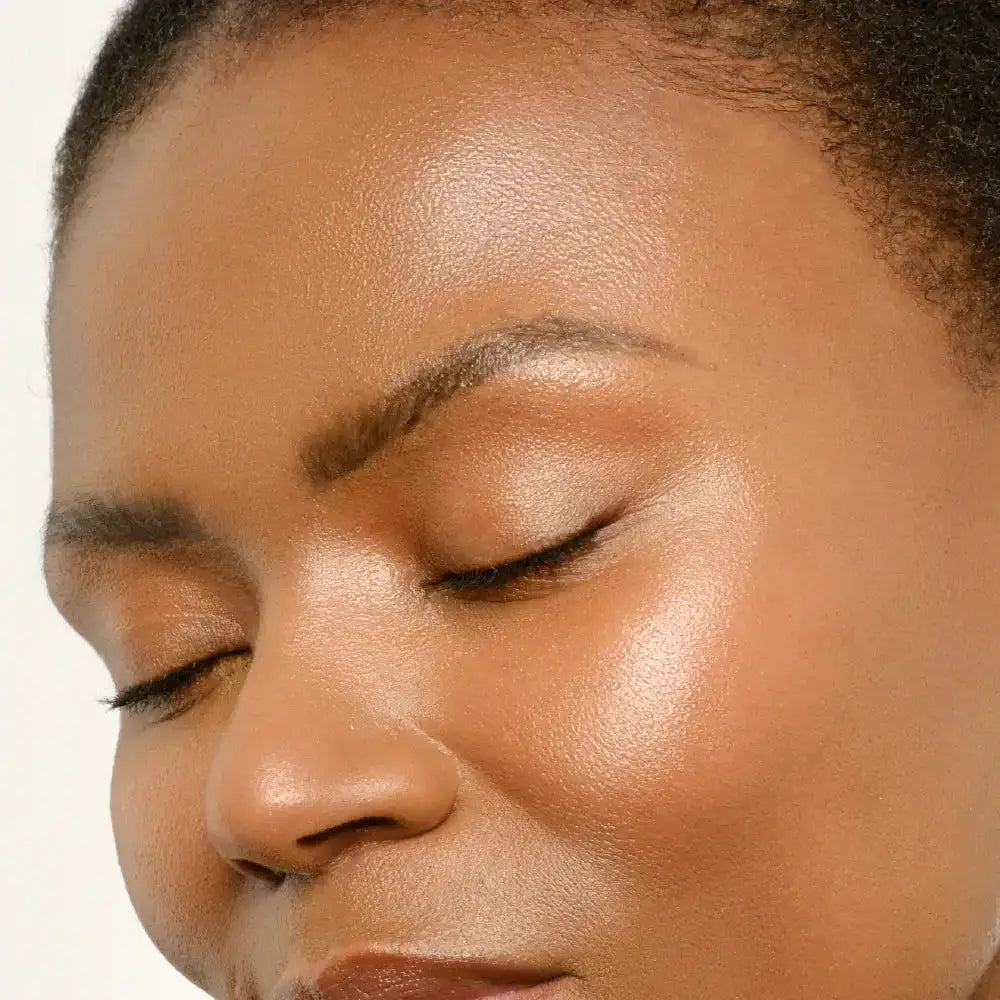 Close-up of a person with a neutral expression on a white background