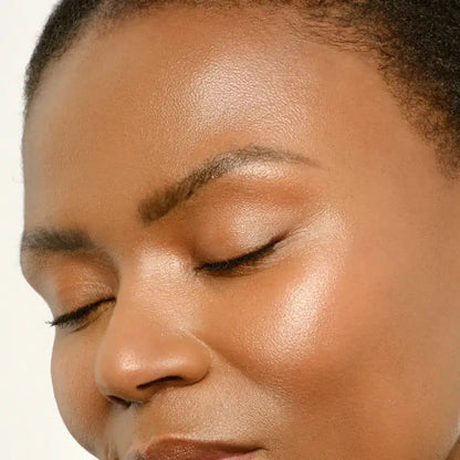Close-up of a person with a neutral expression on a white background